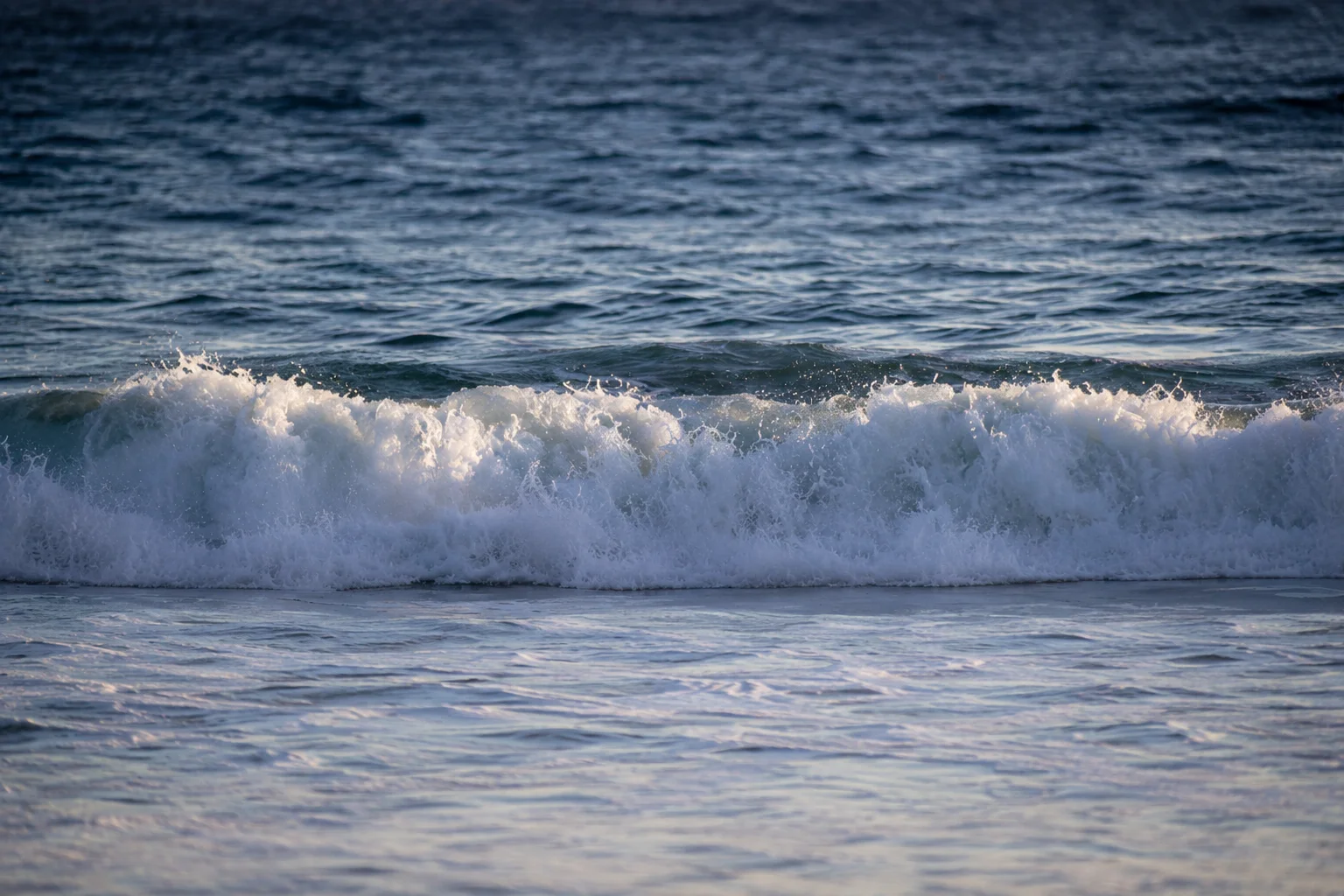 A wave breaks on the shore at Laguna Beach, California