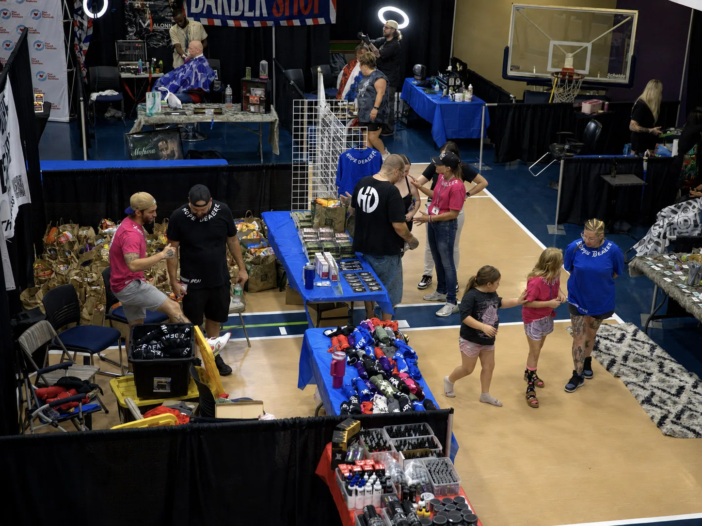 Volunteer tattoo artists and community members gather at the Stop the Hate event inside the Case Community Center in Sand Springs, Oklahoma.